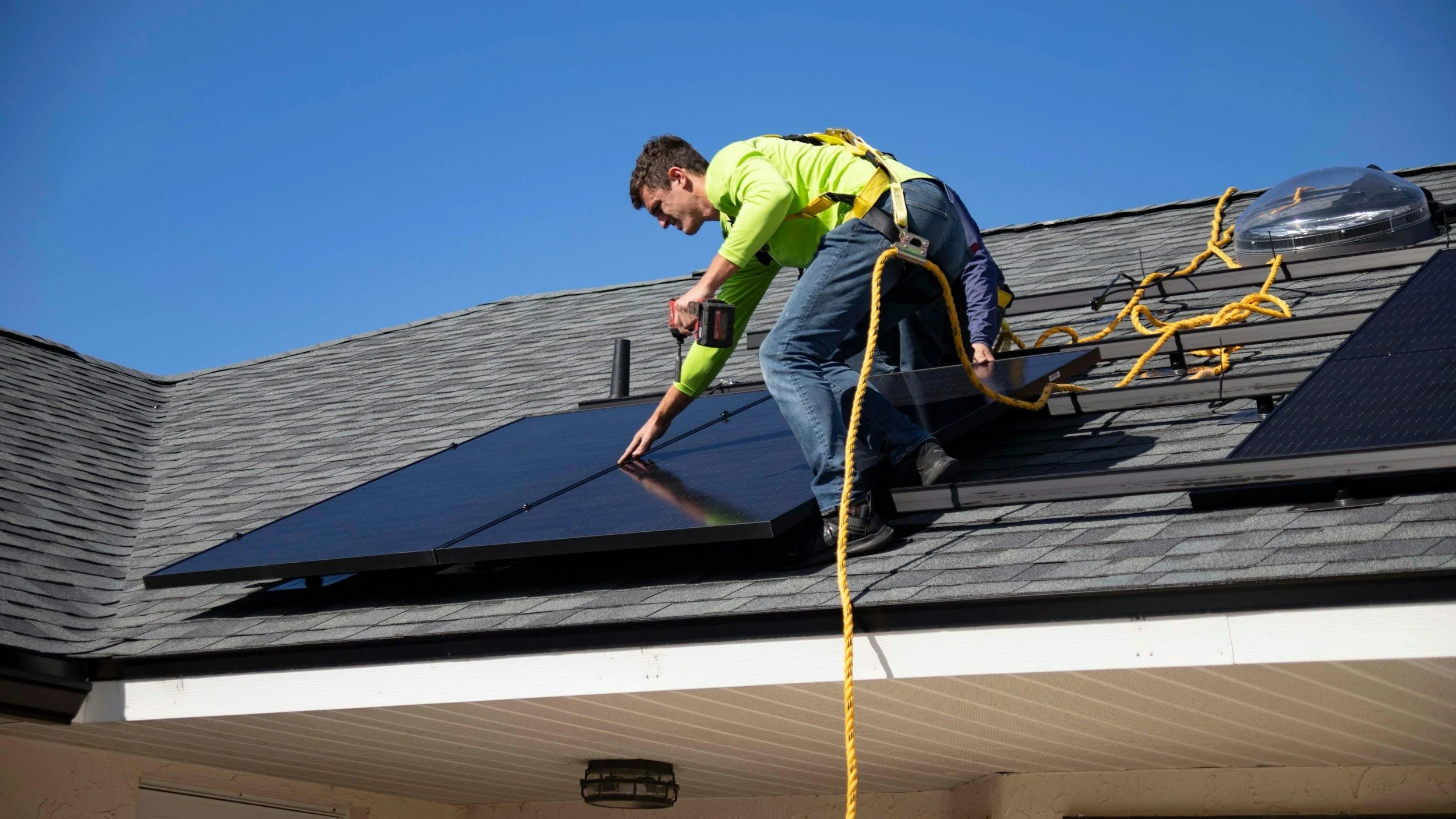Solar panels being installed on a residential house